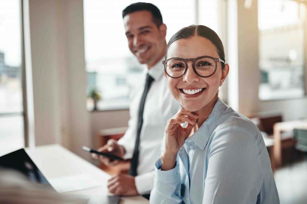 happy colleagues in modern office
